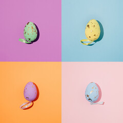 minimal creative composition of easter eggs on colorful pastel background.