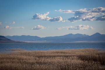 clouds over the mountains and lake