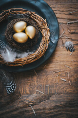 Background with golden decorated easter eggs. Top view, copyspace