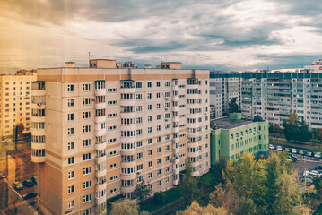 Windows and balconies of the residential building. Old urban obsolete facade of house. The windows...