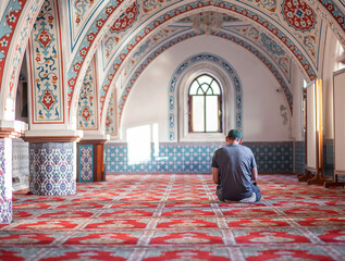 Bearded man praying in the mosque