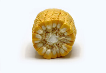 Ear of corn in a cut on a light background. Natural product. Natural structure. Natural color. Close-up.