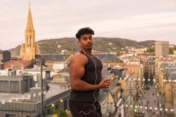 Arab young man doing sport exercises with the city in the background