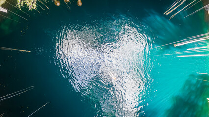 Open Cenote Surrounded with Green Jungle. Aerial View