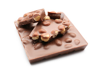 Pieces of tasty chocolate with hazelnuts on white background