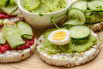 Tray with crispbreads and tasty hummus, closeup
