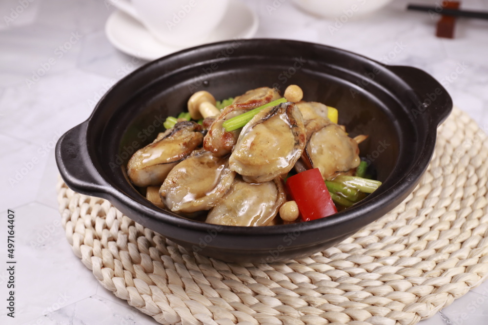 Wall mural oysters with ginger and shallots in a dish isolated on grey background side view of Hong kong food