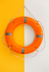 Ring buoy hanging on color wall