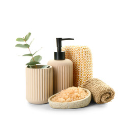 Bottle of cosmetic product, sea salt and bath sponges on white background