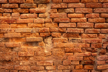 Brick orange uneven old wall texture background, Venice Italy