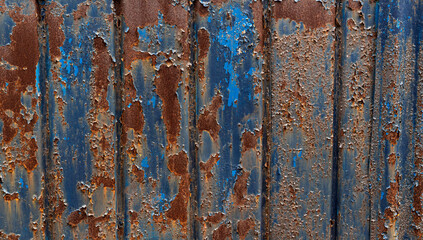 The texture of the fence from the old metal sheet. Sample of an old metal sheet.