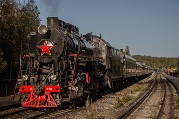 Fototapeta na wymiar Steam locomotive at the Ruskeala Mountain Park station