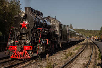 Obraz na płótnie Canvas Steam locomotive at the Ruskeala Mountain Park station