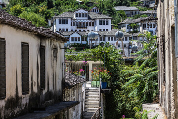 Fototapeta na wymiar Historical town Gjirokaster, old houses with tile roofs, narrow streets, Ottoman architecture in Albania, Unesco World Heritage Site, Gjirokaster, Albania
