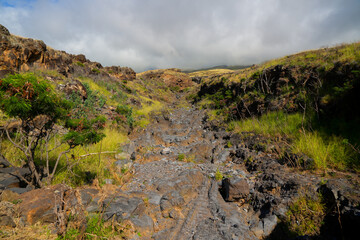 Kamole Gulch along the Piilani Highway in the southeast of Maui island, Hawaii - Rocky dry river bed on the slopes of the Haleakala Volcano mountain