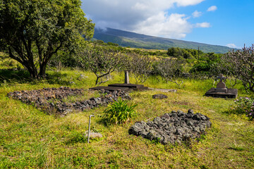 Burial grounds of Saint Joseph Church, built in 1862 along the Piilani Highway in the south of Maui island in Hawaii - Religious building on the slopes of the Haleakala volcano in the Pacific Ocean - obrazy, fototapety, plakaty
