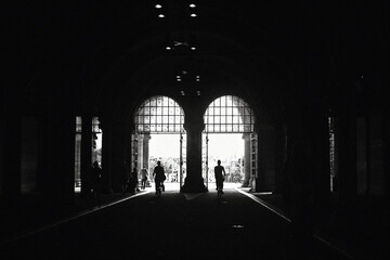 biking through the arches in Amsterdam 