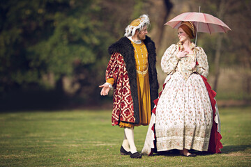 You should walk on royal clouds. Shot of a royal couple spending time together at the gardens. - obrazy, fototapety, plakaty