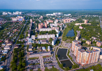 Aerial view of modern residential areas of Chekhov city in sunny spring day, Russia