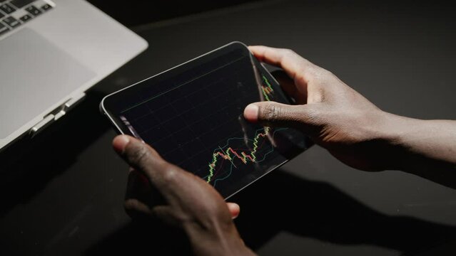 A man checking his investments online