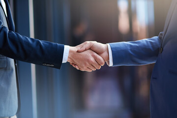 Business collaborations. Cropped shot of two businessmen shaking hands.