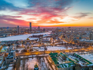 Winter Yekaterinburg and Temple on Blood in beautiful pink and orange sunset. Translation of the text on the temple: Honest to the Lord is the death of His saints.