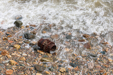 Metal Garbage on the beach, environment pollution