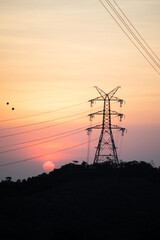 Contast color of Power Line in distribution tower, sunset moment
