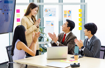 Asian young pretty professional successful businesswoman staff standing greeting say thank you when...