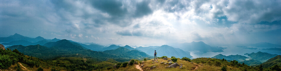 Fototapeta na wymiar Panorama of Man hiking in mountain, Autumn, Sai Kung