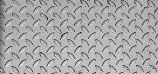 Industrial anti slip embossed stainless steel plate with diagonal bumps. Anti-slip surface. Background. Texture.