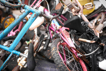 Fototapeta na wymiar Discarded and forgotten. Closeup shot of old bicycles in a rubbish heap.