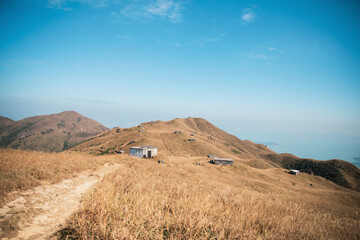 Hikers, Footpath and Houses in the Sunset Peak and Yi Tung Shan, Mountains in Lantau Island, Hong Kong
