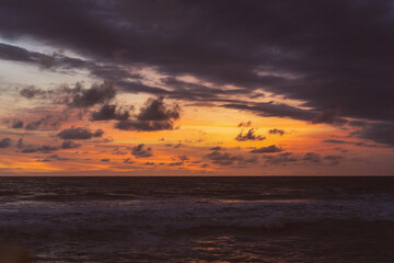 Fototapeta na wymiar Beautiful bright colored sunset on the ocean.