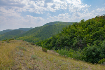 Naklejka premium picturesque fields and mountains in georgia in summer