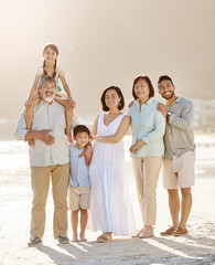 Fototapeta premium Always make time for your family. Full length shot of a happy diverse multi-generational family at the beach.