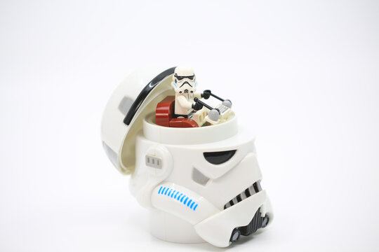 Hong Kong - April 4 2022: the white figurine open the head and sit inside it which also wear the similar helmet