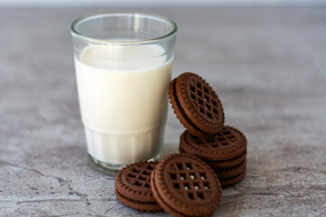 Chocolate chip cookies with milk on a light background. Chocolate sandwich - cookies.