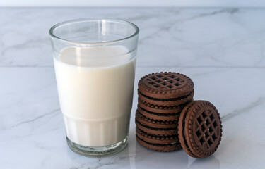 Chocolate chip cookies with milk on a light background. Chocolate sandwich - cookies.