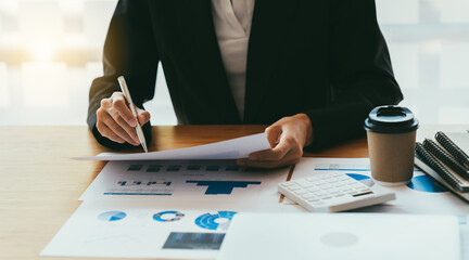 Businesswoman hands hold documents with financial statistic stock photo,discussion and analysis...