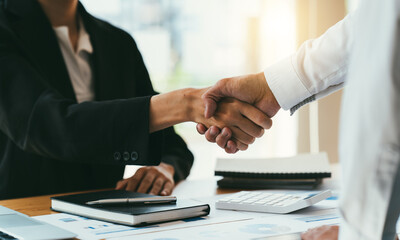 Business people shaking hands, finishing up meeting