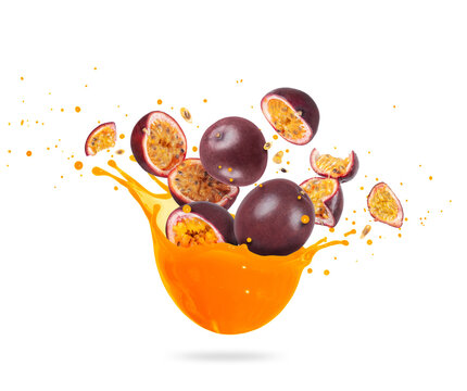 Chopped ripe passion fruits (Passiflora) with splashes of fresh juice, isolated on a white background