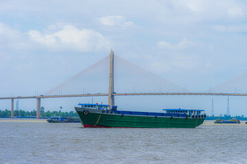 View of My Tho city, Tan Long island and marina, Rach Mieu bridge with transportation, energy power infrastructure in Mekong Delta, day and night.