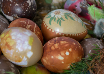 Easter eggs, European Easter with traditional decoration eggs, easter eggs decorated with natural fresh leaves and boiled in onions peels and blueberry berries