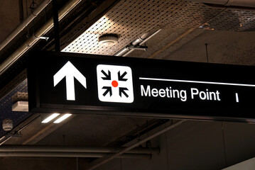 Meeting point sign at the airport, light sign.