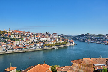 Fototapeta na wymiar View over Porto with the river Douro and the iron bridge in the back