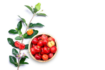 Acerola cherry with cut in half and leaves on white background.