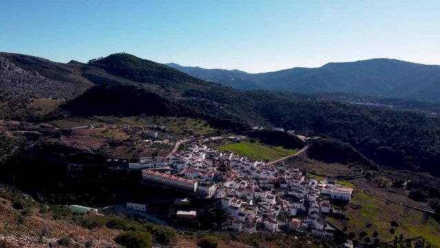Aerial view dolly in of the city of cabra, andalucia, spain with mountains around.