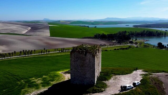 Aerial orbit of the Torre del Aguila, in Palmar de Troya, Seville on a sunny day