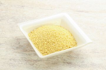 Raw couscous in the bowl